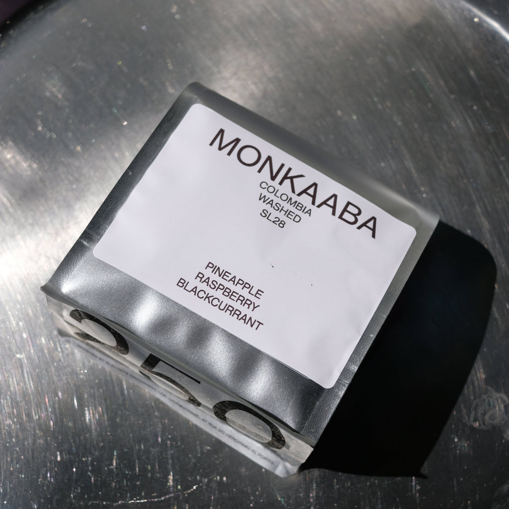 Monkaaba coffee bag on a metallic surface.
