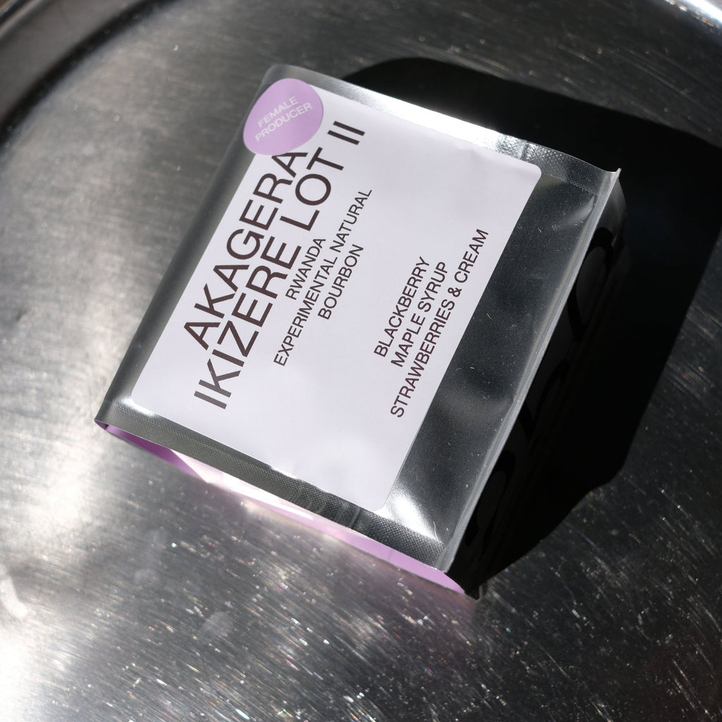 Akagera Ikizerelot II coffee packaging laying on a metallic surface.