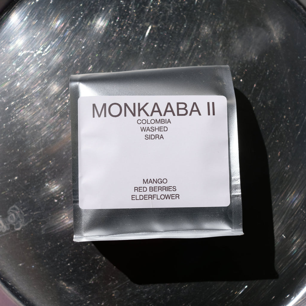 Monkaab II coffee bag on a reflective surface